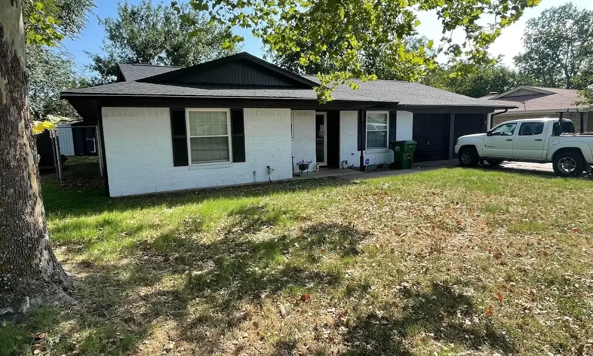 Professional roofing crew working on a residential roof in Hickory Hills
